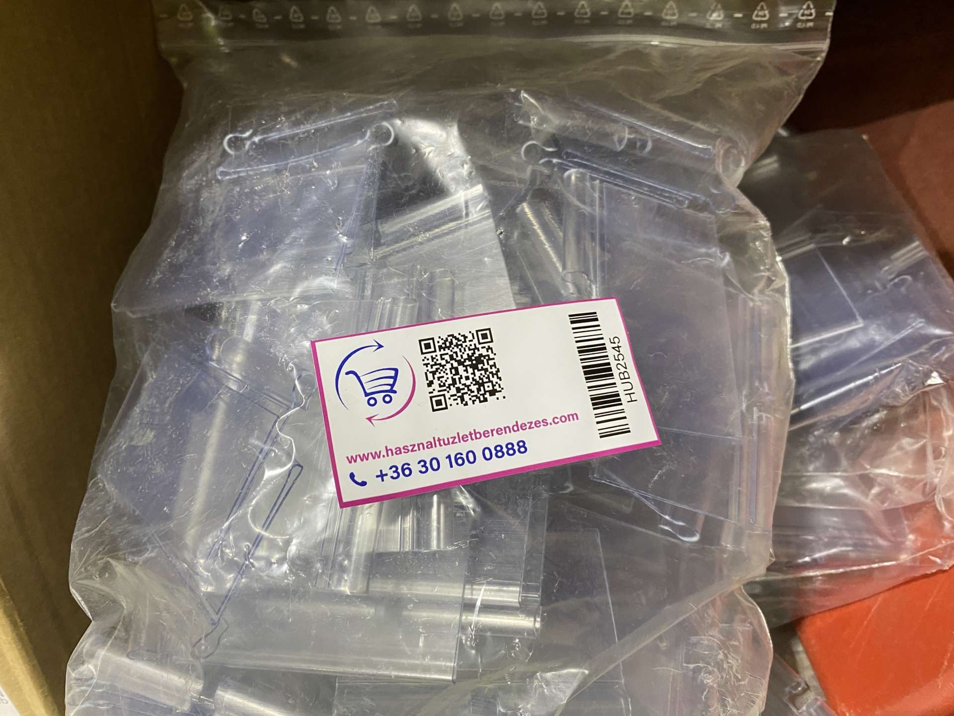 Árcímke tartó, "fityegő" polcímke tartó, polcsín (100 db-os kiszerelés)